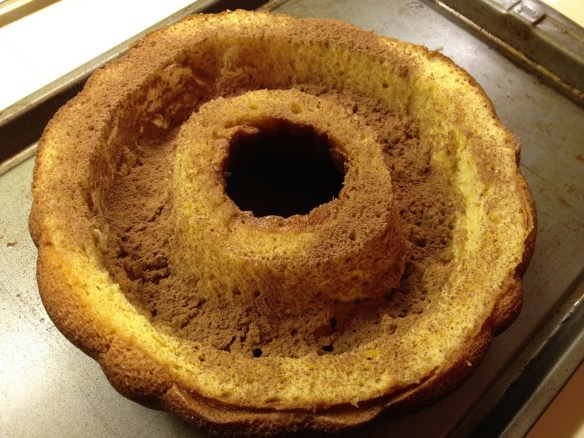 hollowed rum cake with cocoa powder