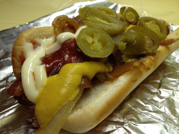 Bacon wrapped hot dog with everything